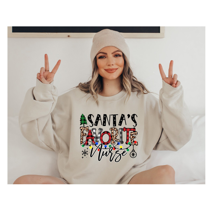 Santas Favorite Nurse Sweatshirt, Christmas Nurse Sweatshirt, Christmas Gift for Nurse, Nurse Christmas Hoodie, Cute Holiday Nurse Sweater 1.jpg