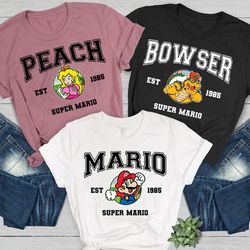 super mario character shirt  mario luigi yoshi peach bowser toad koopa kamek tshirt  super mario bros est. 1985 shirt  m