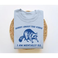 sorry about the vibes, funny sweatshirt, funny crewneck, raccoon sweatshirt, cartoon meme top, vintage cartoon sweater,