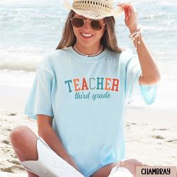 preppy third grade teacher shirt, collegiate comfort colors 3rd grade teacher tshirt, college 3rd grade teacher team gif