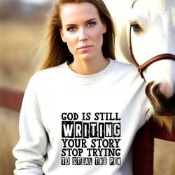 god is still writing your story shirt,belif in god shirt,belief quote shirts,church group shirts,best faith sweatshirt,c