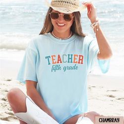 preppy fifth grade teacher shirt, collegiate comfort colors 5th grade teacher tshirt, college 5th grade teacher team gif