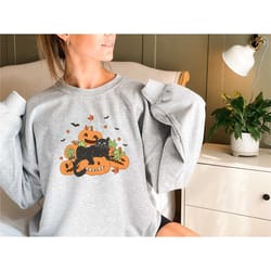 black cat on pumpkin sweatshirt, fall for fall, black chat sweater, halloween black cat design, halloween gifts for the