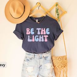be the light t-shirt for women, christian tee for women, cute christian tshirt, retro jesus shirt for christian apparel