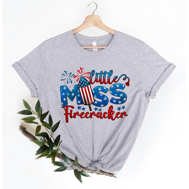 Little Miss Firecracker Shirt, 4th of July Shirt, Patriotic Shirt, Fireworks T-Shirt, American Flag Tee, Stars Shirt, 4th of July Gift.jpg