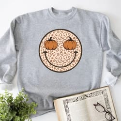 pumpkin spice thanksgiving shirt, fall smile leopard sweatshirt, pumpkin smile face crewneck, fall season sweatshirt