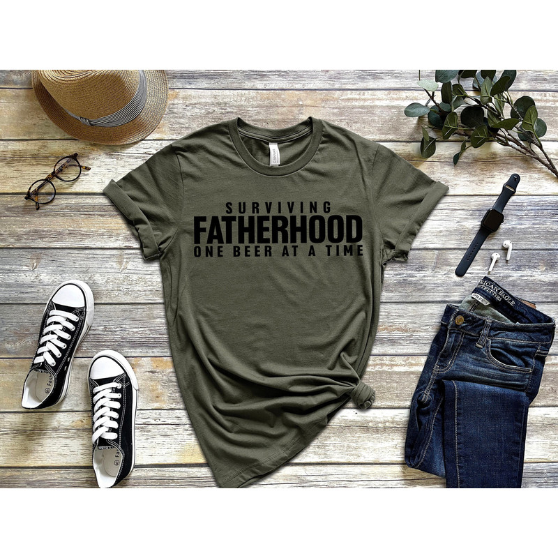 Surviving Fatherhood Shirt, Beer Lover Shirt, Fathers Day Gift, Funny Father Day Shirt, Funny Dad Gifts, New Dad Shirt, Dad Birthday Gift.jpg