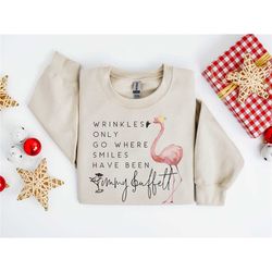 wrinkles only go where smiles have been sweatshirt, flamingo jimmy buffett memorial t-shirt, jimmy buffett long-sleeve