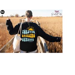forever chasing sunsets sweatshirt, aesthetic girl group camp shirt, women's trendy hoodie with words on back, hippie sh