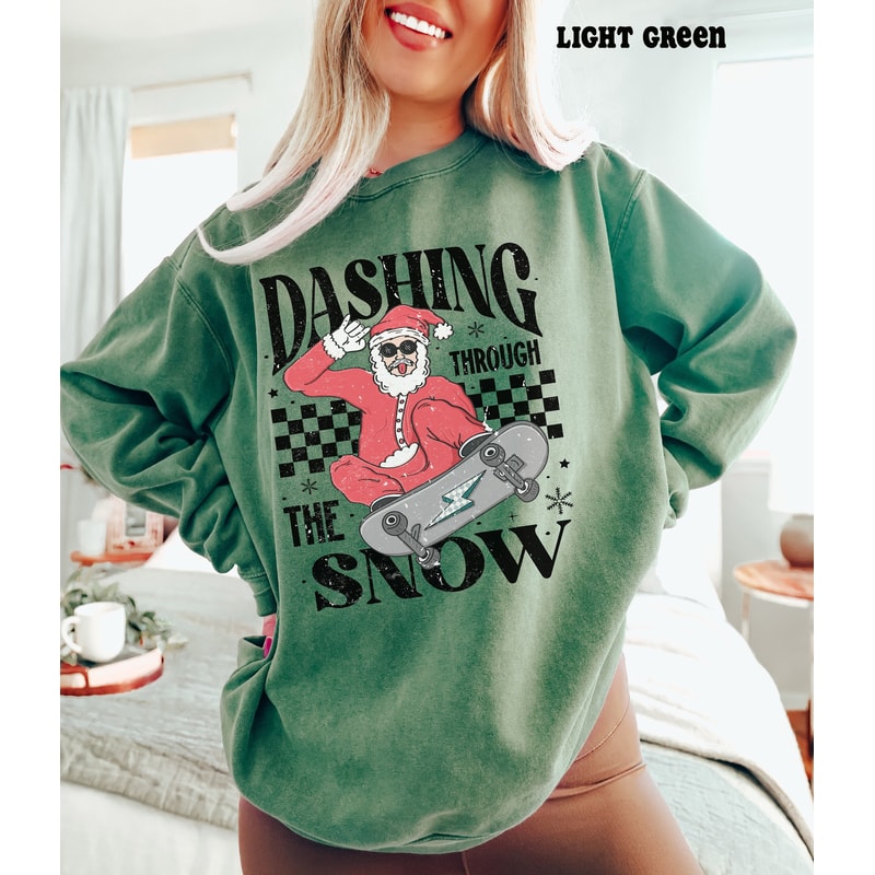 Comfort ColorsĀ® Christmas Santa Sweatshirt, Dashing Through Snow Santa Skateboard Christmas Hoodie, Retro Christmas Crewneck Sweater.jpg