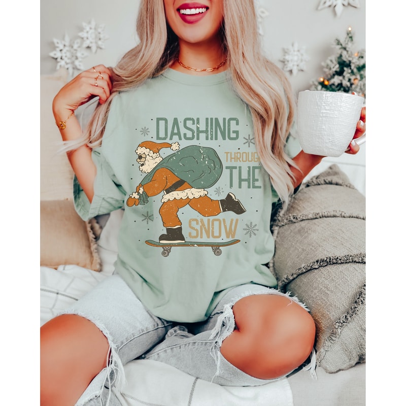 Comfort ColorsĀ® Funny Christmas Santa Shirt, Dashing Through Snow Santa Skateboard T Shirt for women, Retro Christmas Holiday Party Tee.jpg