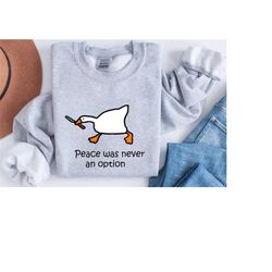 murder duck crewneck sweatshirt, untitled duck game, duck with knife meme shirt, comfy funny goose sweatshirt, peace was