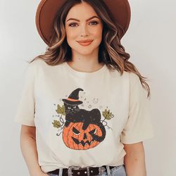 black cat on pumpkin shirt, pumpkin shirt shirt, for fall, black cat shirt, halloween black cat design, halloween gifts
