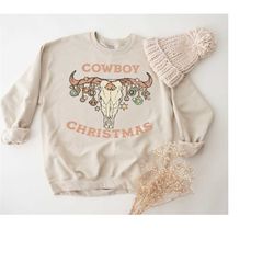 cowboy christmas shirt, western xmas tee, country christmas shirt, cow skull christmas sweatshirt, cowboy holiday shirt,