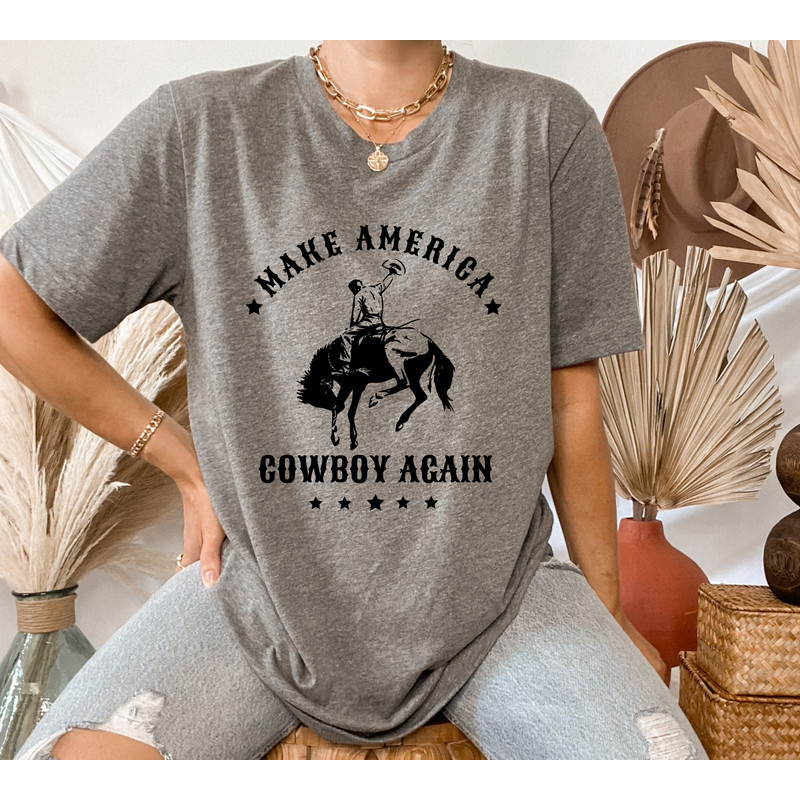 Make America Cowboy Again Shirt, Western Graphic tee, Rodeo gift, Cowgirl Shirt, American western tee, Patriotic rodeo shirt, Western Shirt.jpg