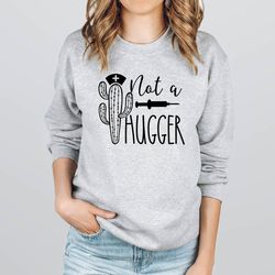 not a hugger sweatshirt,nurse gft,nurse sweatshirt,cactus sweatshirt,healthcare workers,essential worker sweathirt,no hu