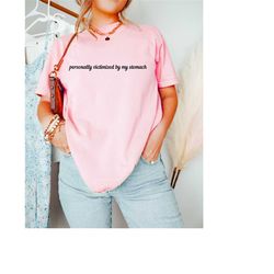 personally victimized by my stomach. tummy ache survivor, funny ibs shirt, trendy women shirts, my tummy hurts shirt, fu