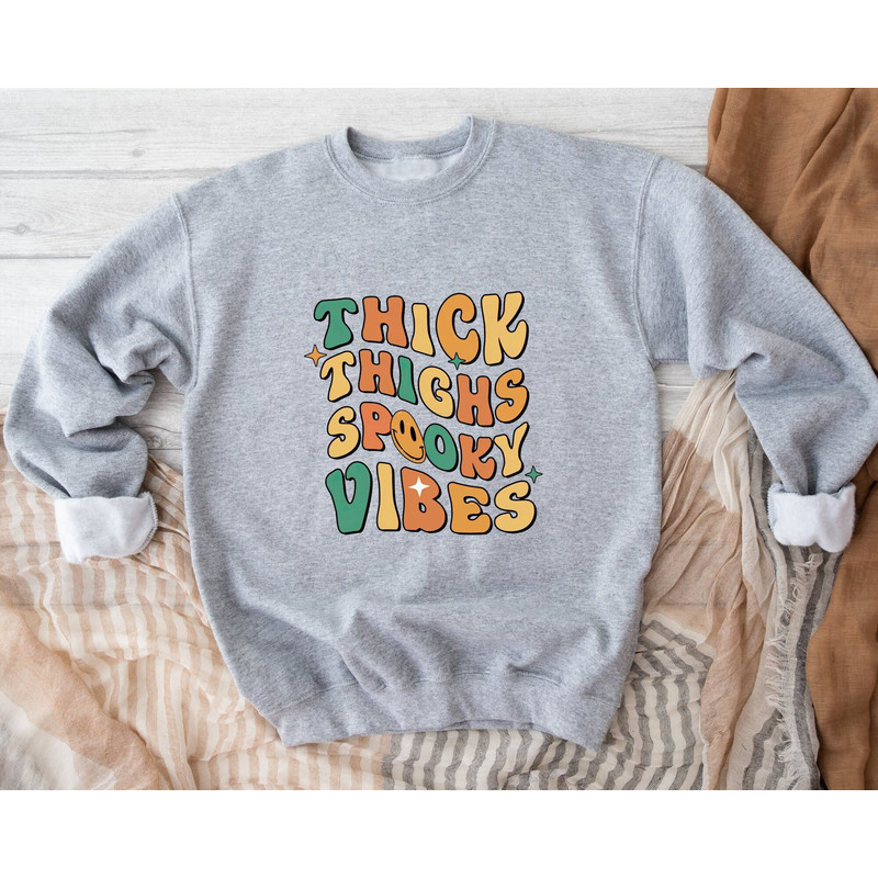 Thick Thighs and Spooky Vibes Sweatshirt, Funny Halloween Sweatshirt, Halloween Party Sweatshirt, Spooky Season Sweatshirt, Retro Halloween.jpg