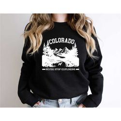 colorado sweatshirt, never stop exploring sweater, colorado holiday shirt, colorado traveler shirt, camping tee, state m