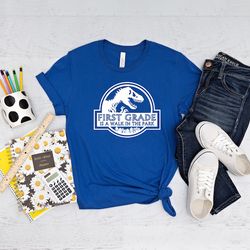 first grade is in a park walk shirt, 1st grade dinosaur shirt, 2nd grade shirt, kindergarten shirt, preschool shirt