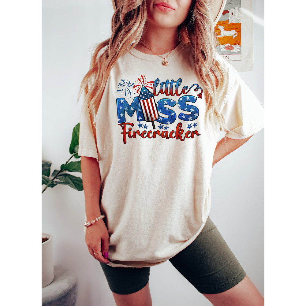 Little Miss Firecracker Shirt, 4th of July Shirt, Patriotic Shirt, Fireworks T-Shirt, American Flag Tee, Stars Shirt, 4th of July Gift.jpg