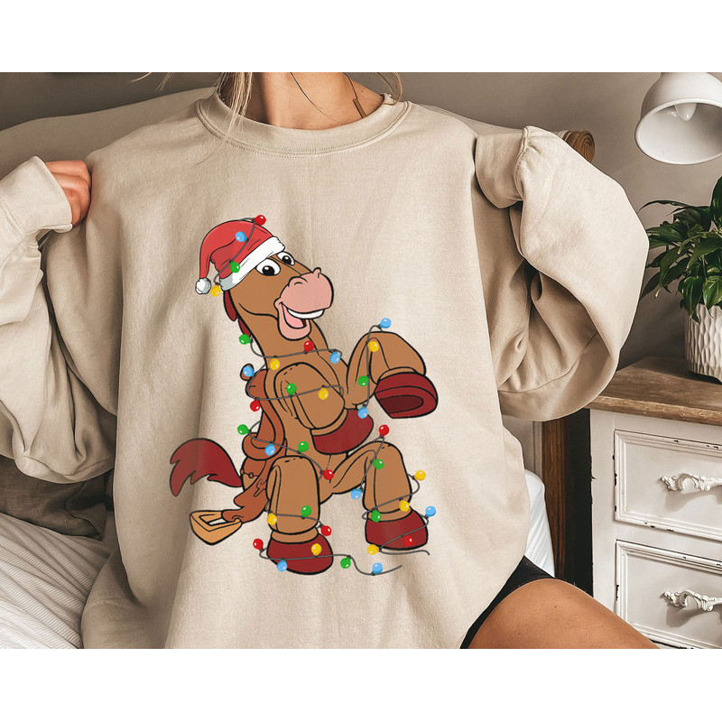 Toy Story Bullseye Wear Santa Hat With Christmas Light Disney Horse A Very Merry Shirt Family Matching Walt Disney World Shirt Gift Ideas.jpg