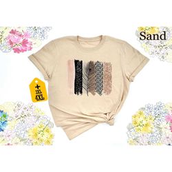 unique safari brush strokes with black feather shirt,