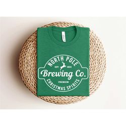north pole brewing co shirt, premium christmas spirits,
