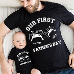 custom our first father's day gaming 2024 shirt, daddy baby matching shirts, matching dad and baby bodysuit, matching da