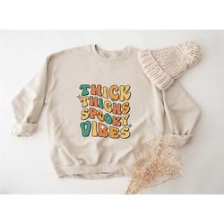 thick thighs and spooky vibes sweatshirt, retro halloween sweatshirt, halloween party sweatshirt, spooky season sweatshi