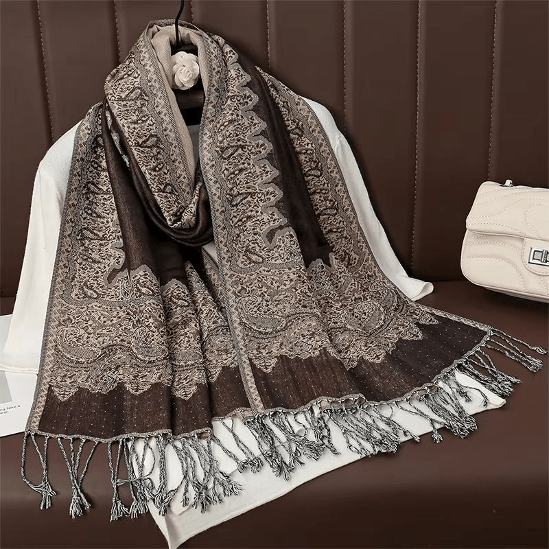 folded pashmina shawl on travel suitcase