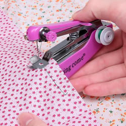 mini handheld sewing machine for quick travel clothing repairs