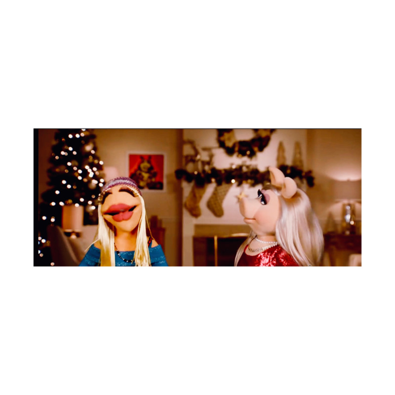 Miss Piggy and Janice celebrate Christmas .png