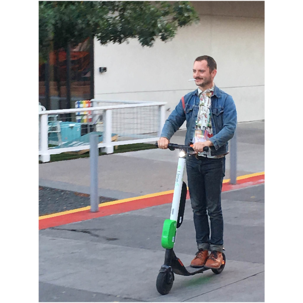 elijah wood on a scooter.png