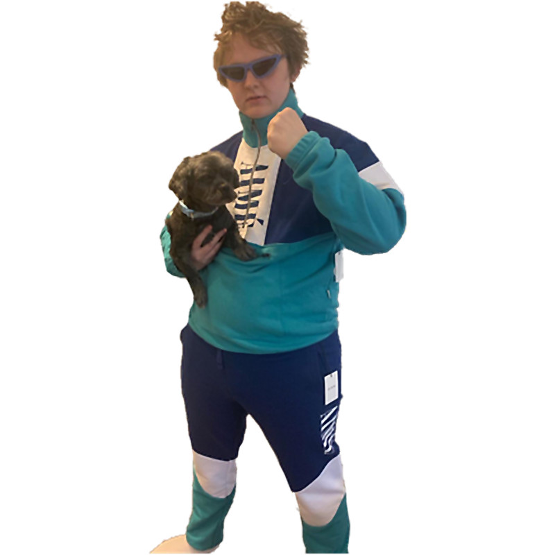 Lewis Capaldi Holding Dog in Tracksuit.png