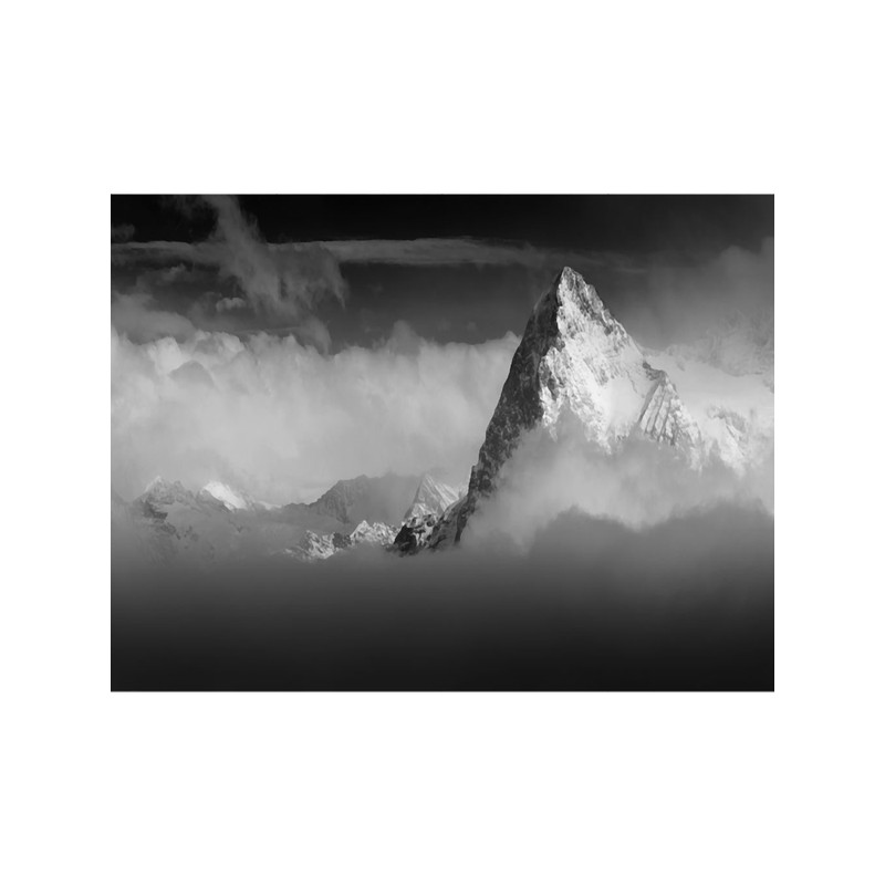 The Eiger North Face Switzerland Alps rising above the clouds.png