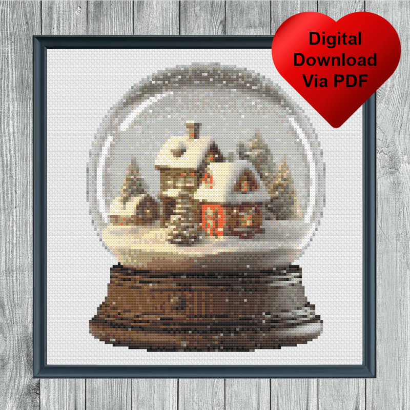 Snow Covered Village Snow Globe Cross Stitch Blue Frame.jpg