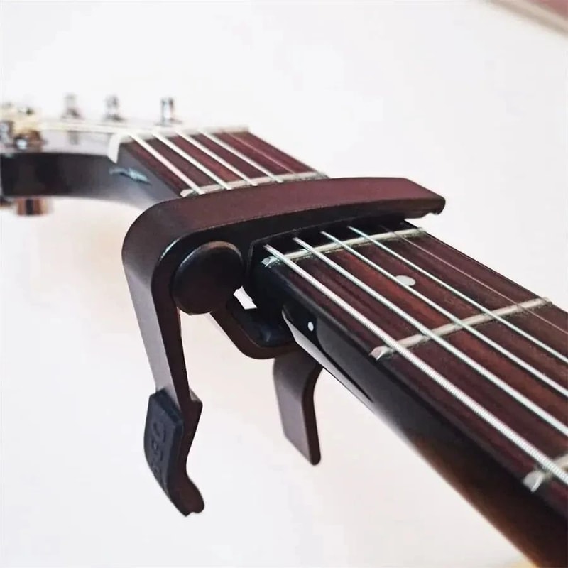 7pcs Guitar Capo Set For Acoustic Electric Guitars Includes 5 Free Picks 1 Holder Available In 3