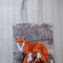 Reusable brown tote bag made of eco-friendly cotton canvas, with a drawing of a fox and small foxes