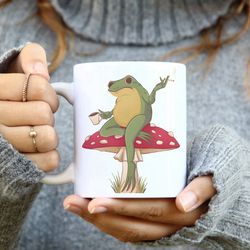 frog on a mushroom coffee mug| funny frog mug| mushroom and frog mug| frog meme| cottagecore| funny novelty mug gift
