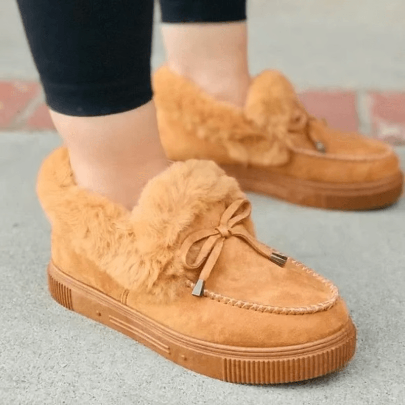 Female teacher walking across schoolyard in warm cotton shoes
