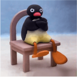 Very Angy Pingu Sitting On A Chair