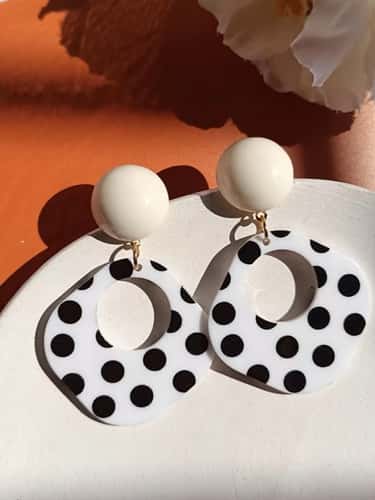 A Pair of Black and White large Polka Dot Hollow Geometric Shape Nostalgia Harbor Wind Earrings