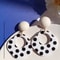 A Pair of Black and White large Polka Dot Hollow Geometric Shape Nostalgia Harbor Wind Earrings