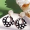 A Pair of Black and White large Polka Dot Hollow Geometric Shape Nostalgia Harbor Wind Earrings