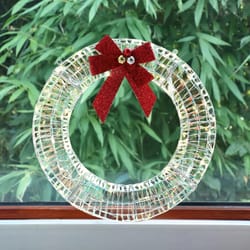pre-lit christmas wreath with warm white led lights and red bows perfect for indoor & outdoor holiday decor