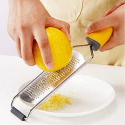 premium stainless steel zester and lemon grater perfect for cheese, citrus, and parmesan shredding