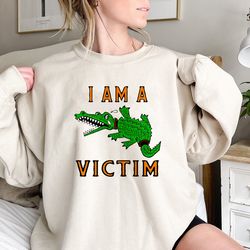 i am a victim crocodile sweatshirt, funny sarcastic saying graphic unisex t-shirt for men women