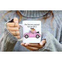 the horrors persist but so do i frog white coffee mug, funny frog meme mug, silly & quirky, sarcastic adult humour gift.