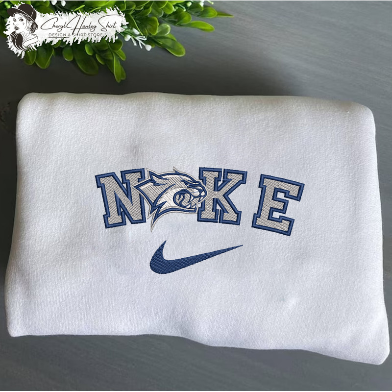 Nike New Hampshire Wildcats Embroidered Sweatshirt, NCAA Embroidered Sweater, New Hampshire Wildcats Shirt, Unisex Shirt.jpg